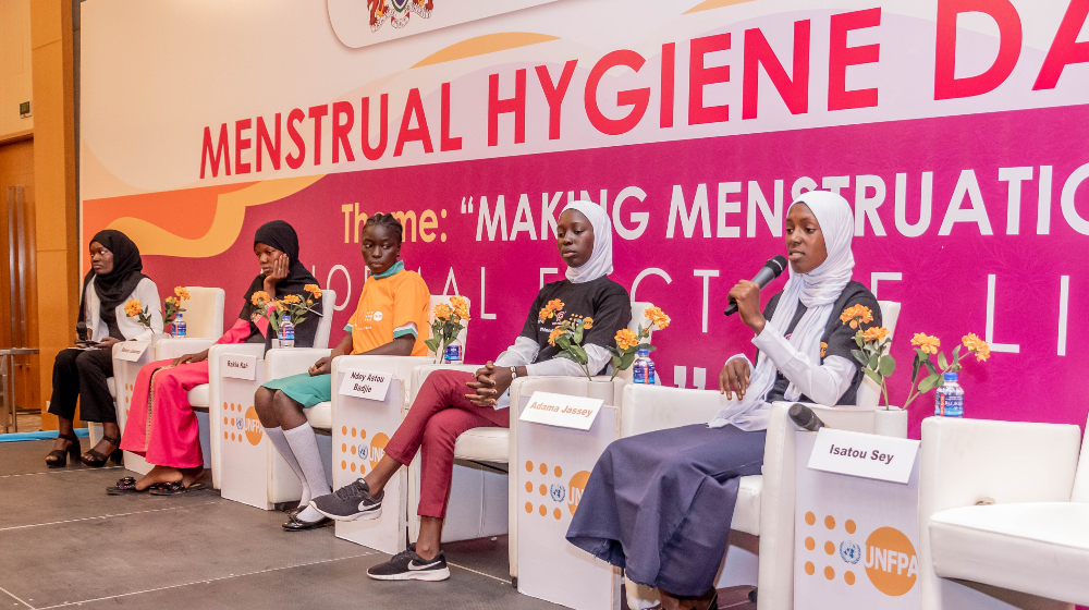 Adolescent girls hold a panel discussion as part of the MHD Symposium