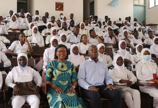 UNFPA Country Representative Ms. Ndeye Rose Sarr joins students for a group photo after the conversation